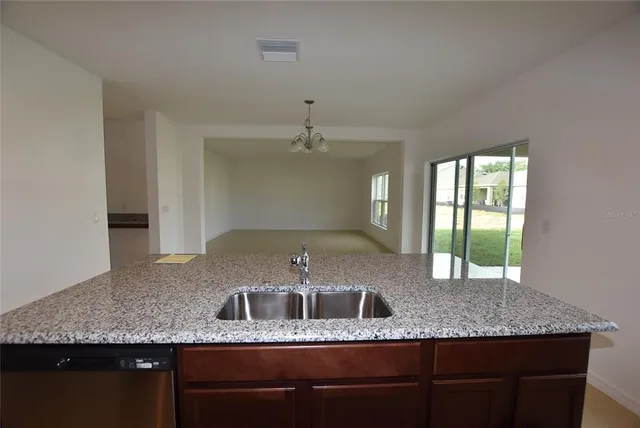 a kitchen with granite countertop a sink and a granite counter tops