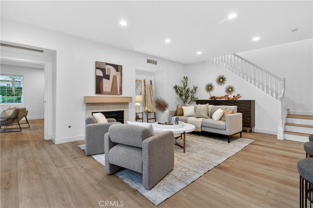 81 Zinnia Street Ladera Ranch, CA 92694 - Photo 13 of 47 a living room with furniture and a fireplace