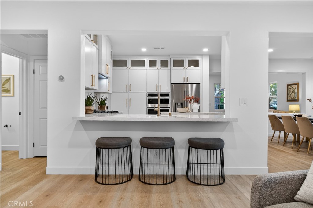 81 Zinnia Street Ladera Ranch, CA 92694 - Photo 15 of 47 a kitchen with white cabinets and counter space