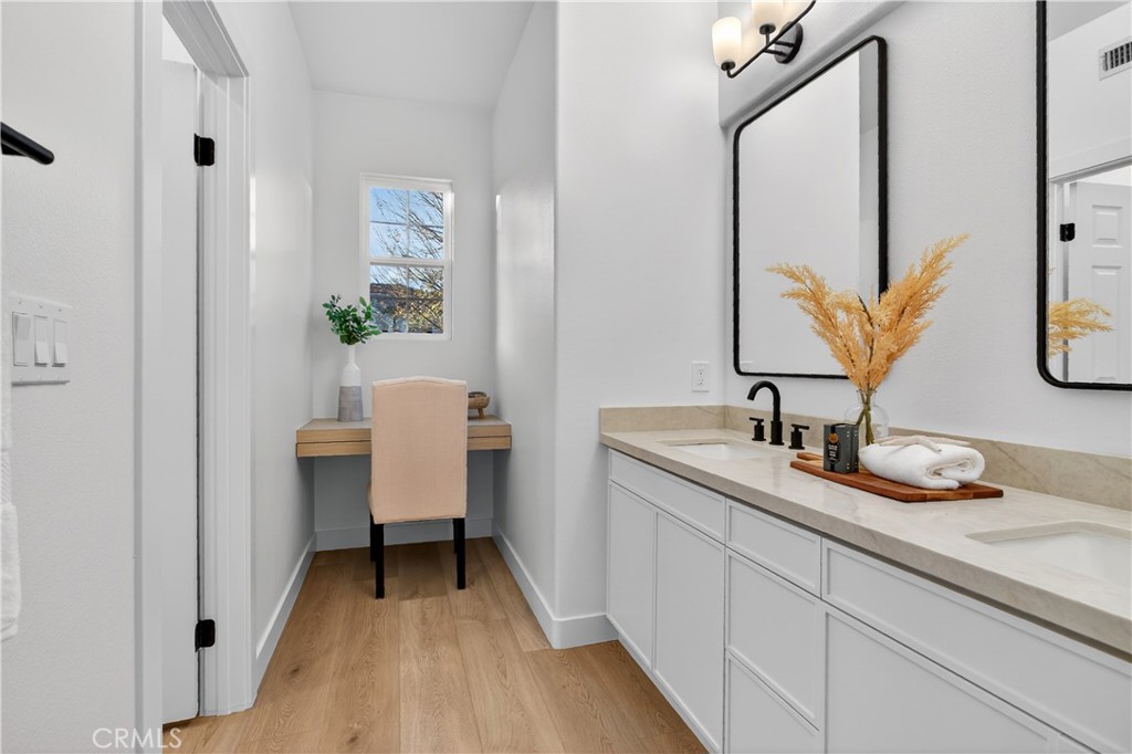 81 Zinnia Street Ladera Ranch, CA 92694 - Photo 29 of 47 a bathroom with a sink and a mirror