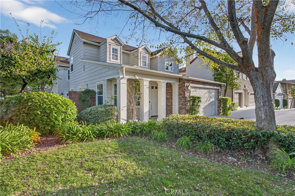 81 Zinnia Street Ladera Ranch, CA 92694 - Photo 3 of 47 front view of a house with a garden