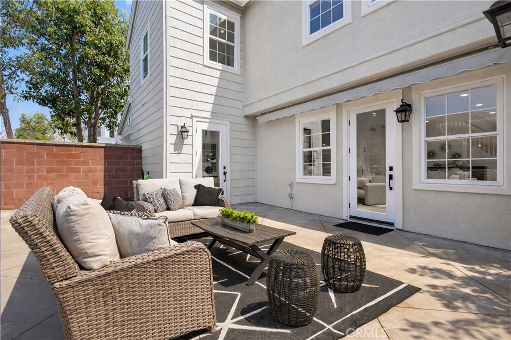81 Zinnia Street Ladera Ranch, CA 92694 - Photo 32 of 47 a view of a patio with couches and potted plants