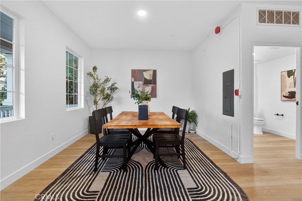81 Zinnia Street Ladera Ranch, CA 92694 - Photo 37 of 47 a dining room with furniture and wooden floor