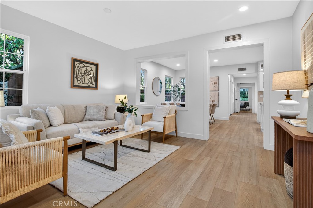 81 Zinnia Street Ladera Ranch, CA 92694 - Photo 4 of 47 a living room with furniture and a wooden floor