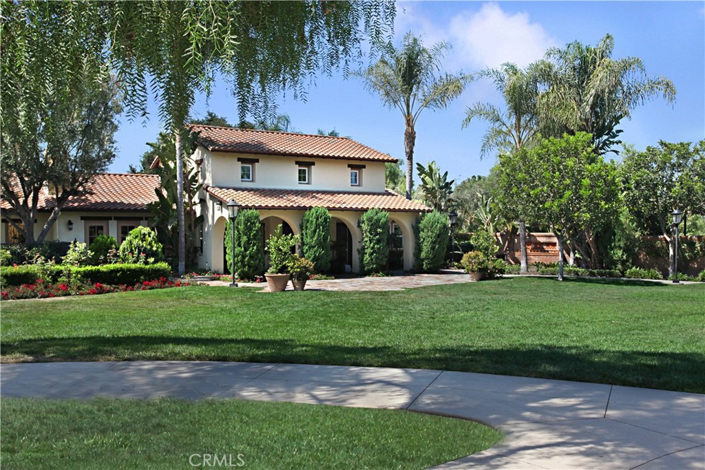 81 Zinnia Street Ladera Ranch, CA 92694 - Photo 45 of 47 a front view of a house with a garden