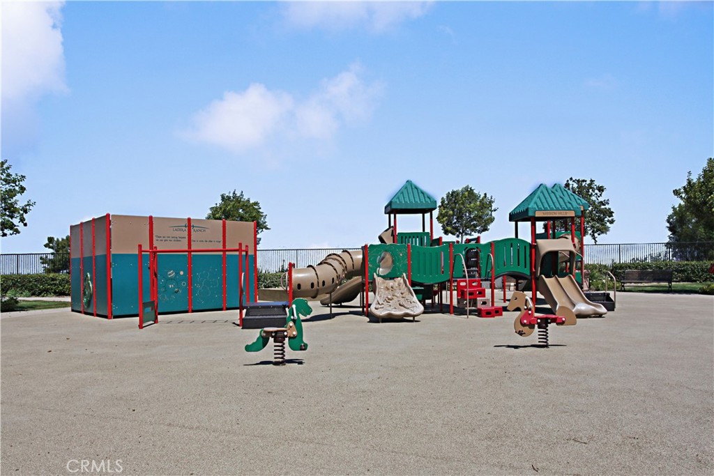 81 Zinnia Street Ladera Ranch, CA 92694 - Photo 47 of 47 a view of a tennis ground with a car parked
