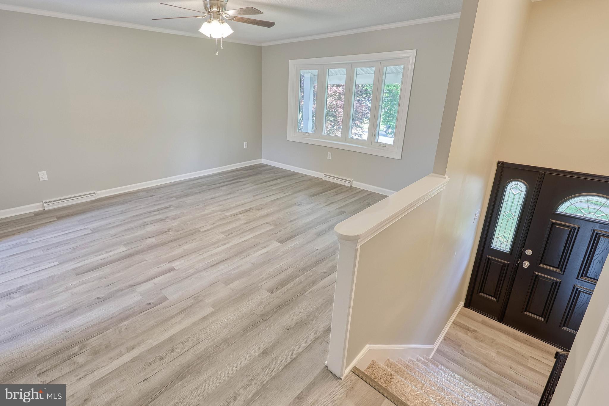 2285 Esbenshade Road York, PA 17408 - Photo 14 of 41 a view of an empty room with wooden floor and a window