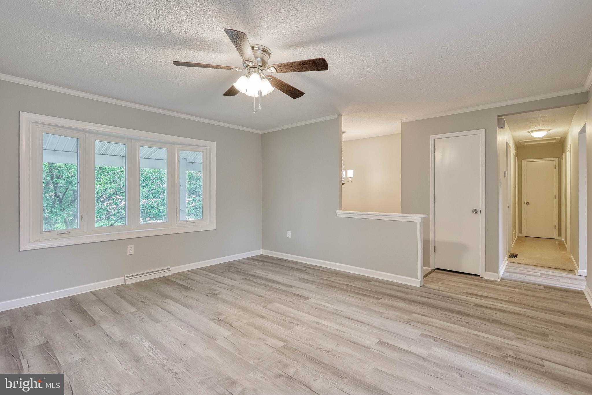2285 Esbenshade Road York, PA 17408 - Photo 15 of 41 a view of an empty room with wooden floor and a window