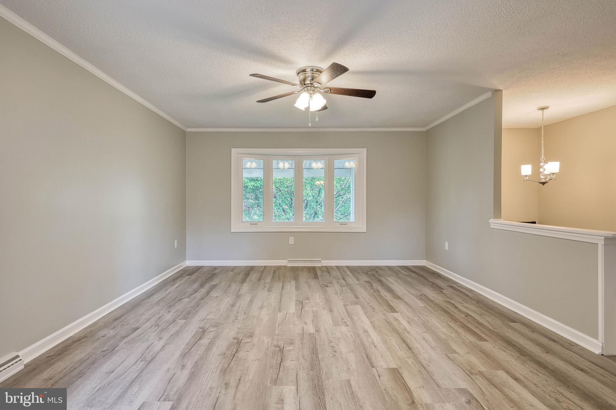 2285 Esbenshade Road York, PA 17408 - Photo 16 of 41 wooden floor in an empty room with a window