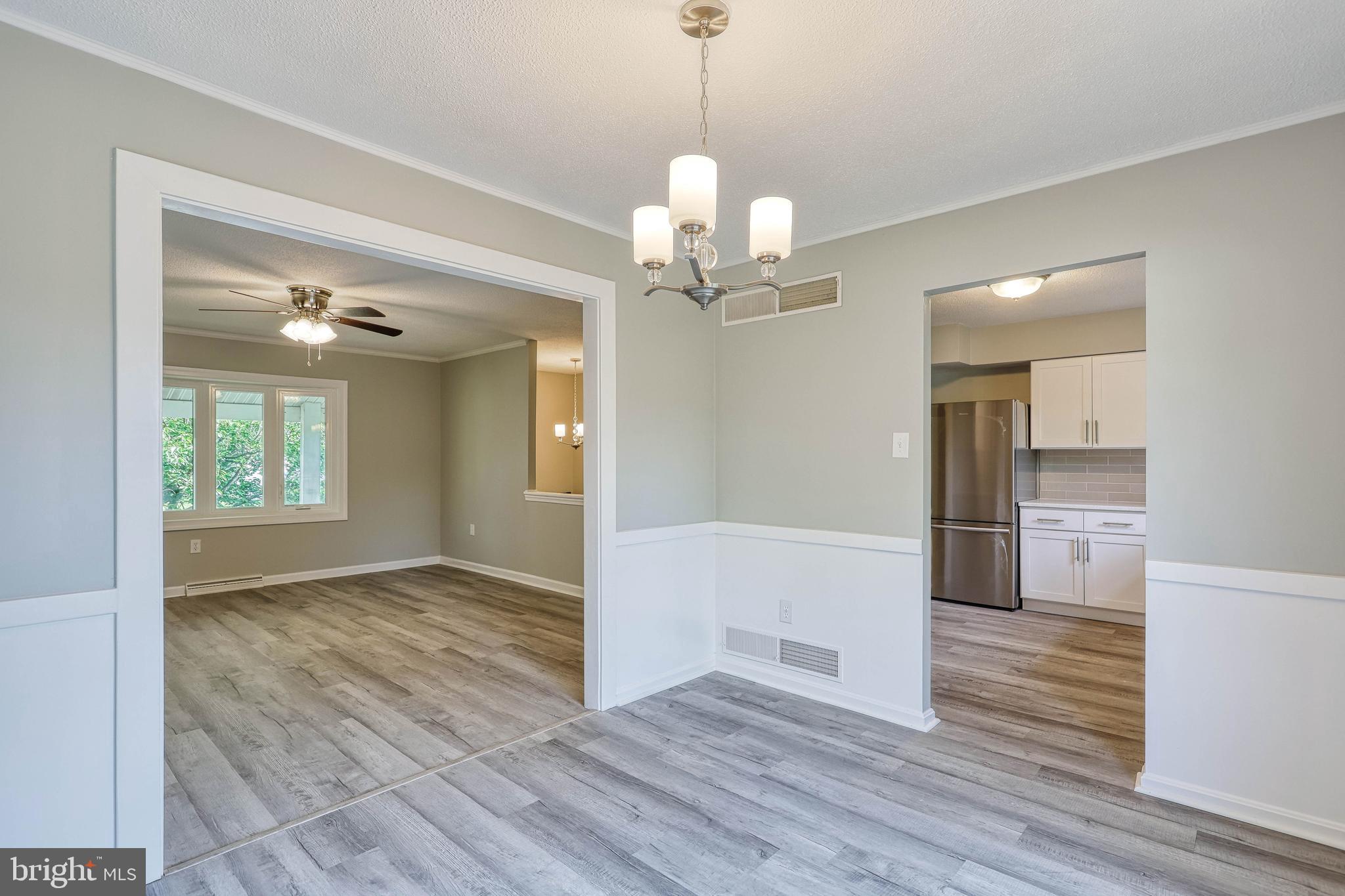 2285 Esbenshade Road York, PA 17408 - Photo 19 of 41 a view of a livingroom with wooden floor and staircase