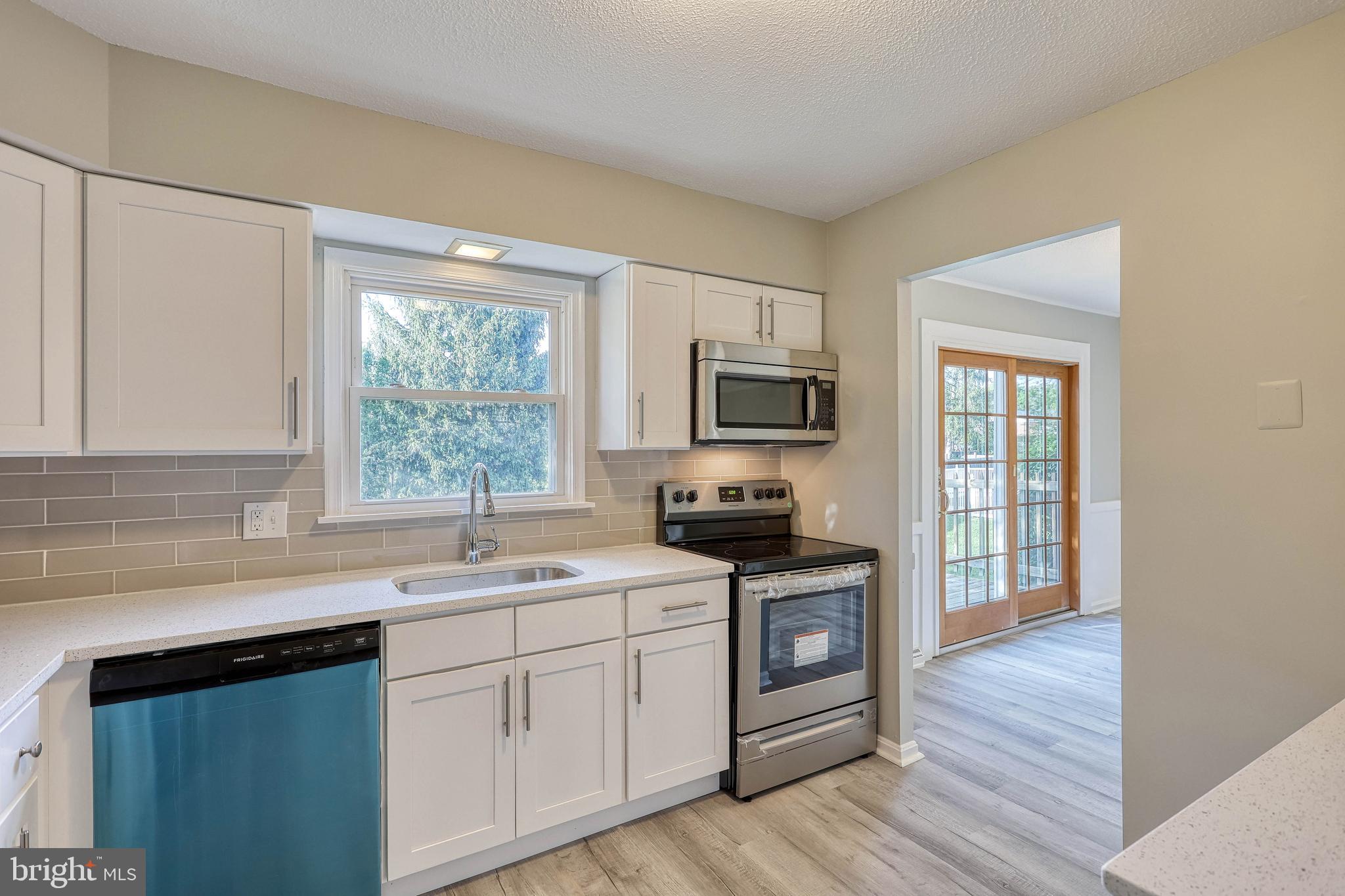 2285 Esbenshade Road York, PA 17408 - Photo 22 of 41 a kitchen with a sink wooden floor and black appliances