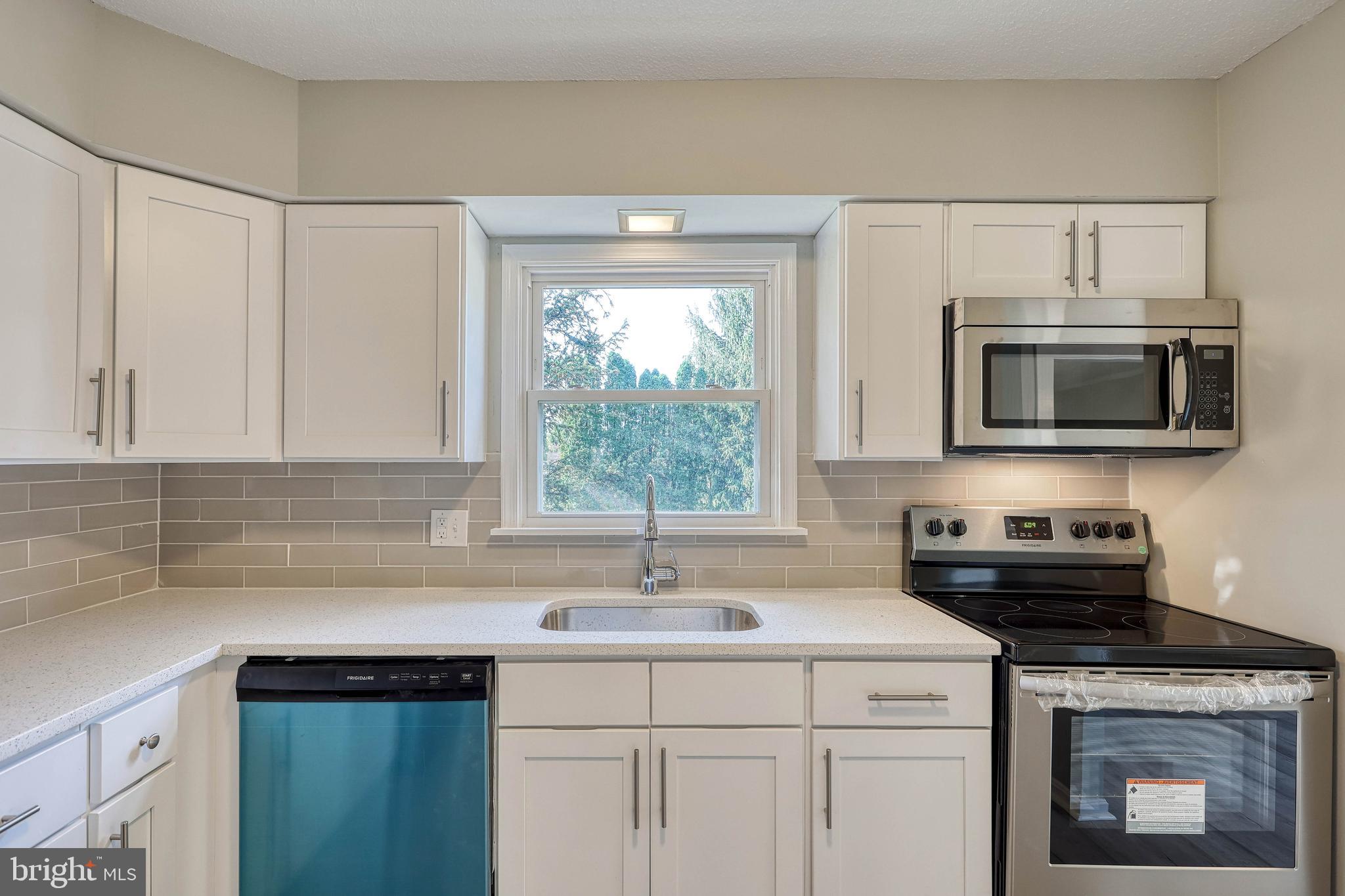2285 Esbenshade Road York, PA 17408 - Photo 23 of 41 a kitchen with a sink stove and microwave