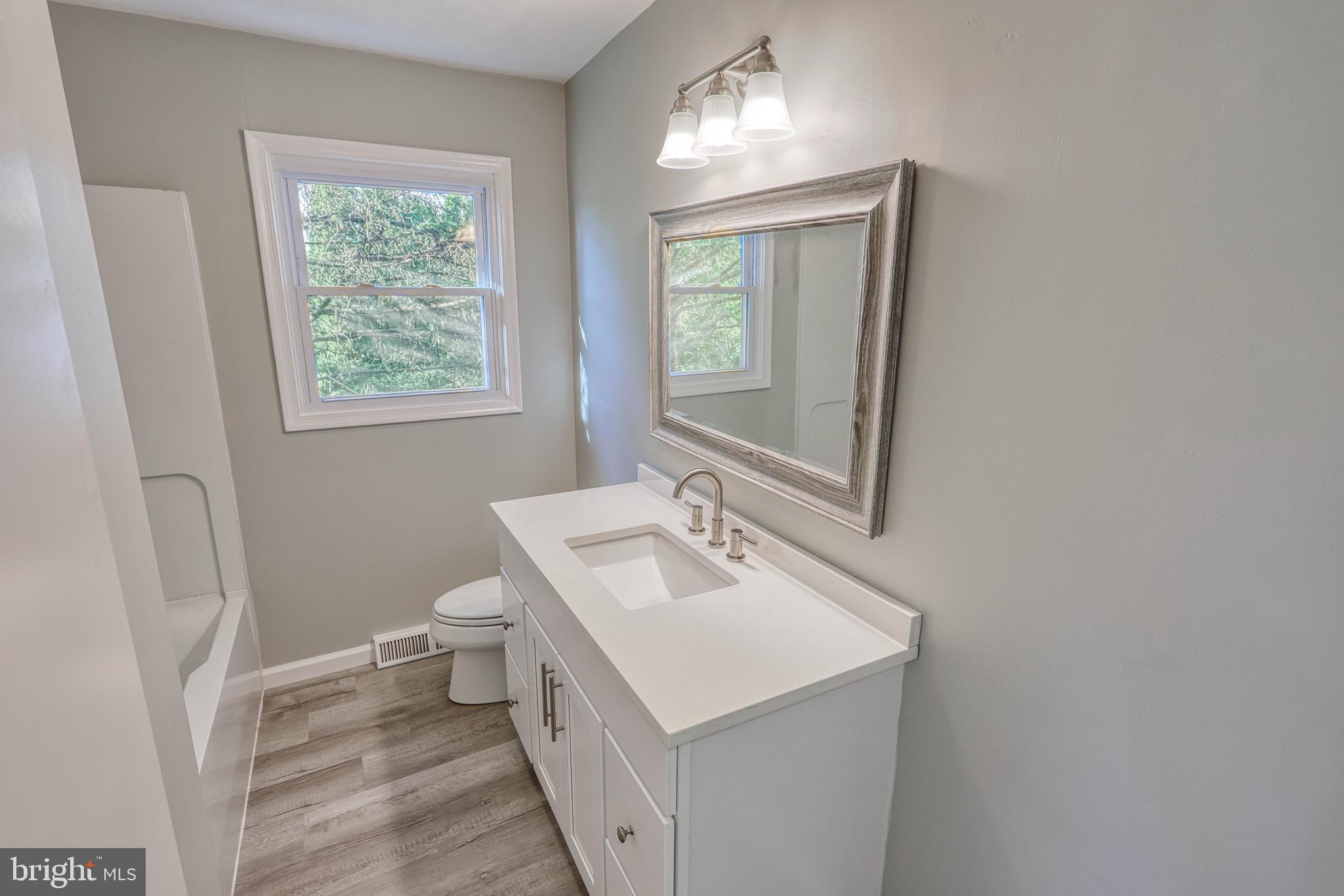 2285 Esbenshade Road York, PA 17408 - Photo 31 of 41 a bathroom with a sink toilet and mirror