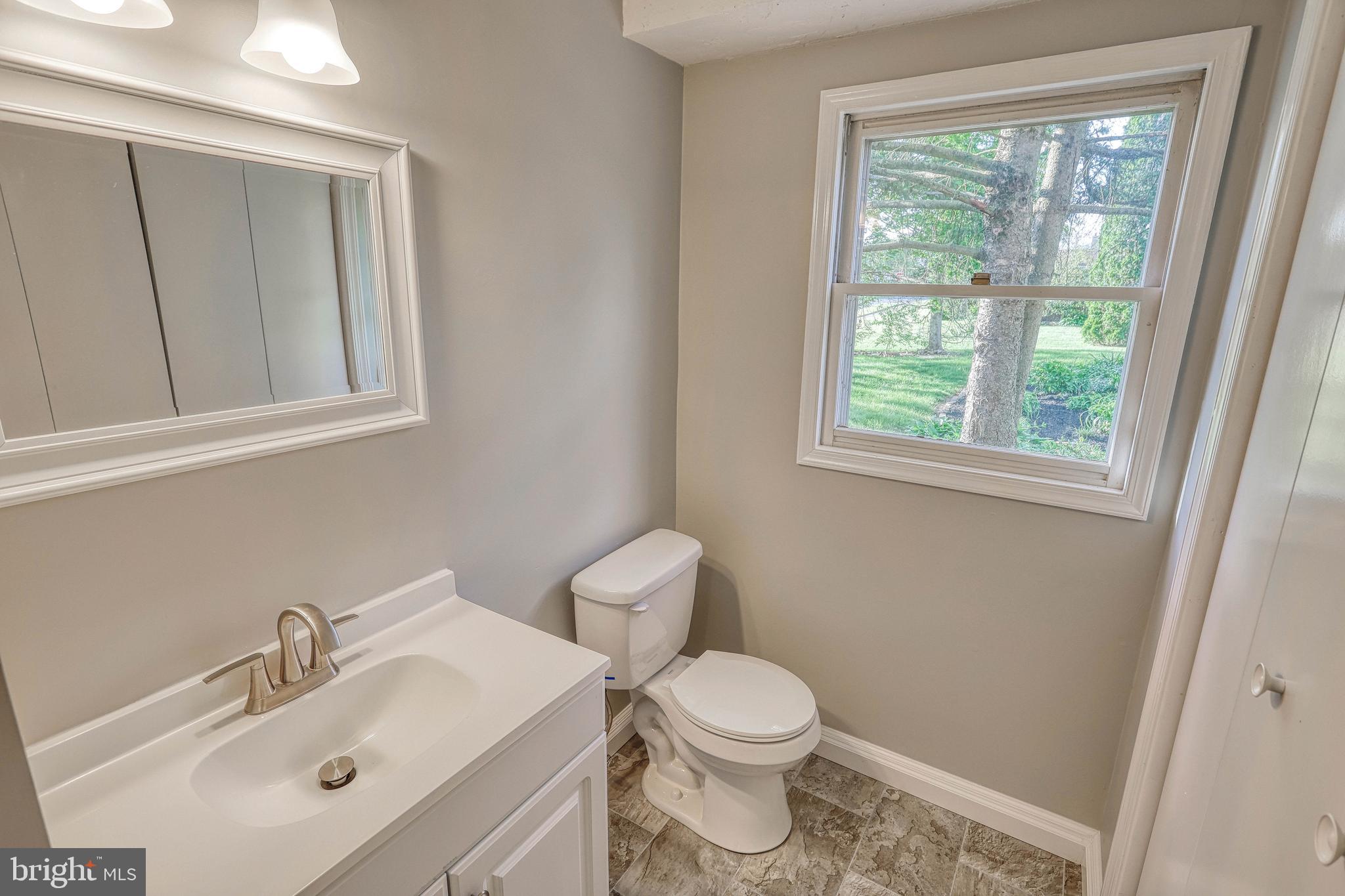 2285 Esbenshade Road York, PA 17408 - Photo 37 of 41 a white toilet sitting next to a bathroom sink
