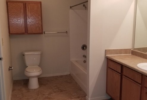 248 Old Osage Road Gatesville, TX 76528 - Photo 9 of 10 a bathroom with a toilet sink and mirror