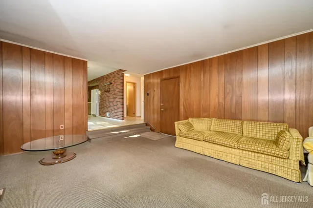 a view of a livingroom with furniture and a fireplace