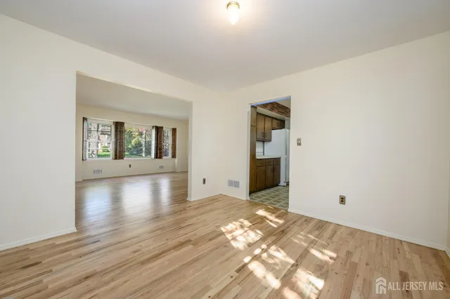a kitchen with a sink cabinets appliances and a window