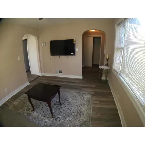 a black and white photo of a living room