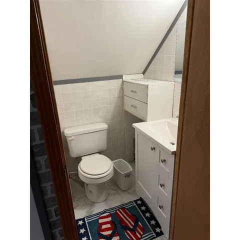 a bathroom with a toilet and a sink