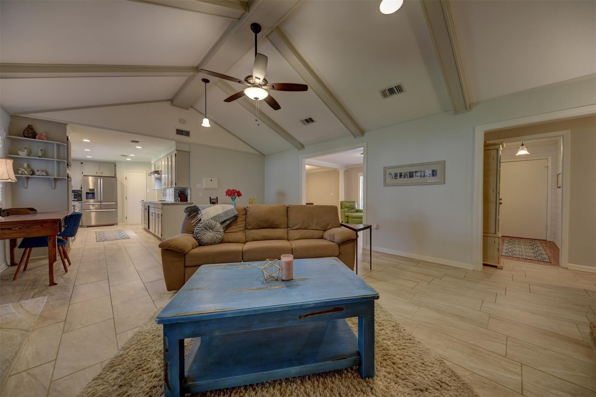 2107 Timber Lane Conroe, TX 77301 - Photo 6 of 12 a living room with furniture a chandelier and a dining table