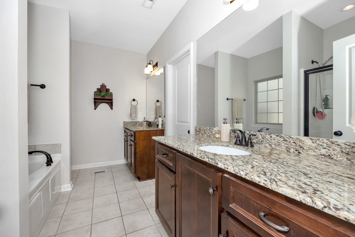 14469 Turnberry Lane Athens, AL 35613 - Photo 13 of 33 a bathroom with a granite countertop sink and a mirror