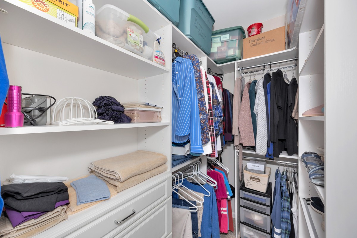 14469 Turnberry Lane Athens, AL 35613 - Photo 18 of 33 a view of walk in closet with clothes and shoes