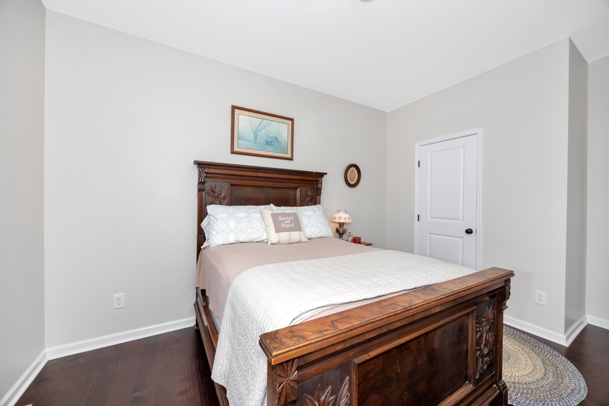 14469 Turnberry Lane Athens, AL 35613 - Photo 20 of 33 a bedroom with a bed and a window