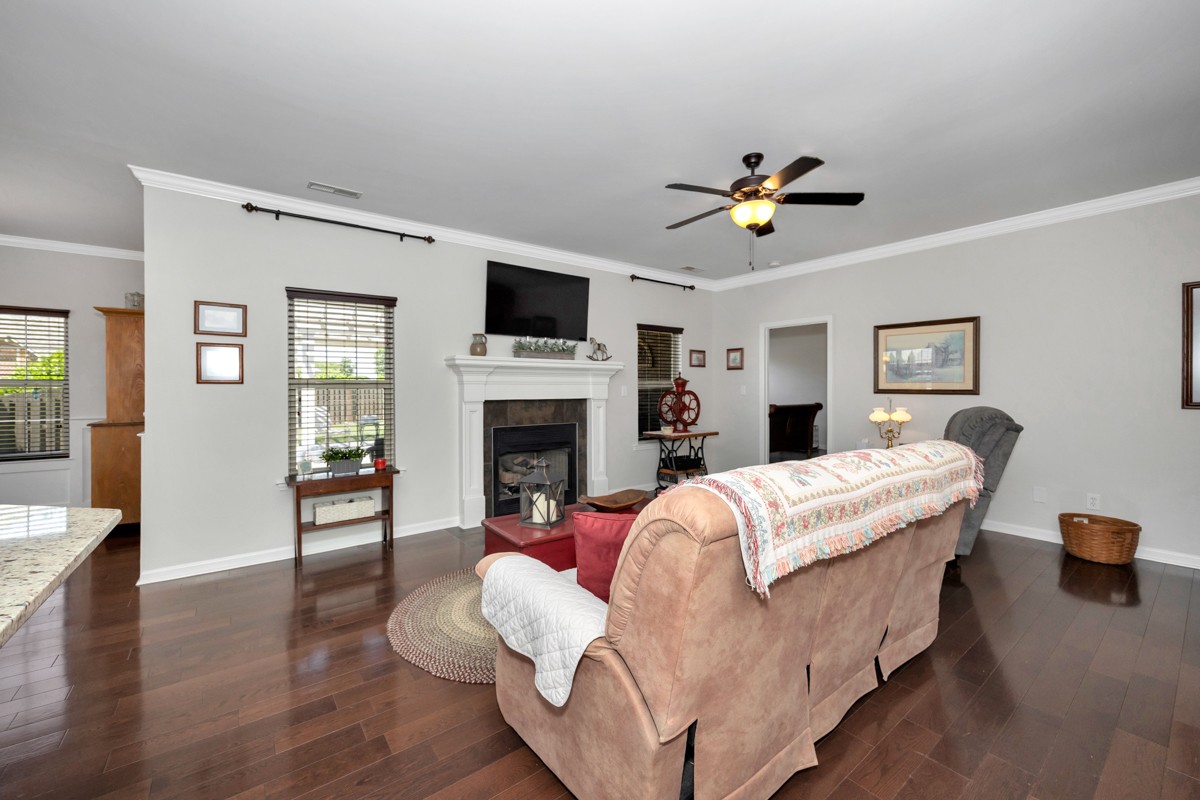14469 Turnberry Lane Athens, AL 35613 - Photo 6 of 33 a living room with furniture fireplace and a flat screen tv