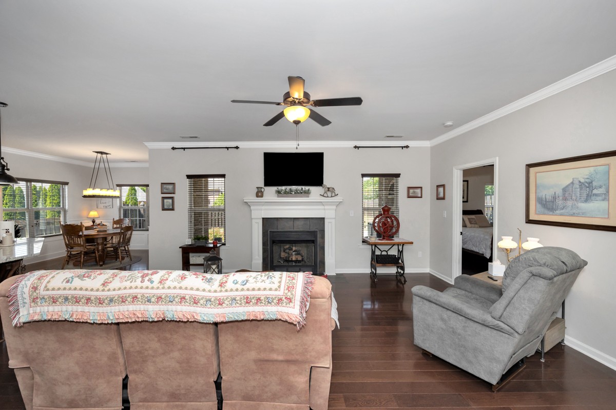 14469 Turnberry Lane Athens, AL 35613 - Photo 7 of 33 a living room with fireplace furniture and a flat screen tv