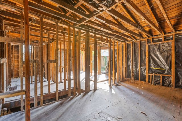 a view of an empty room with stairs