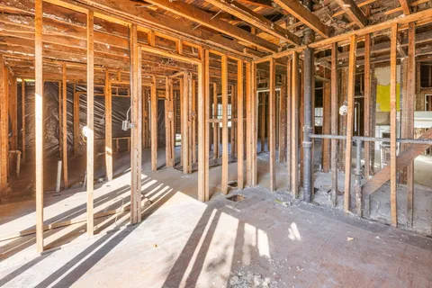 a backyard of a house with barbeque oven
