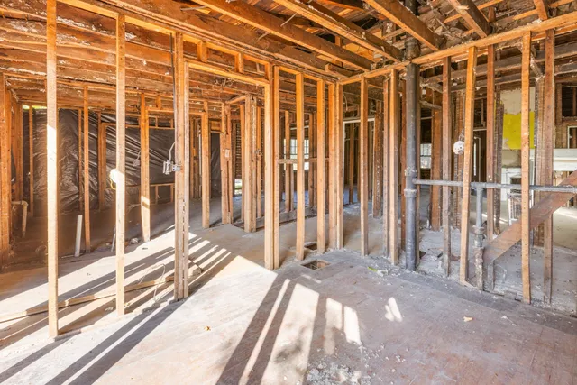 a backyard of a house with barbeque oven