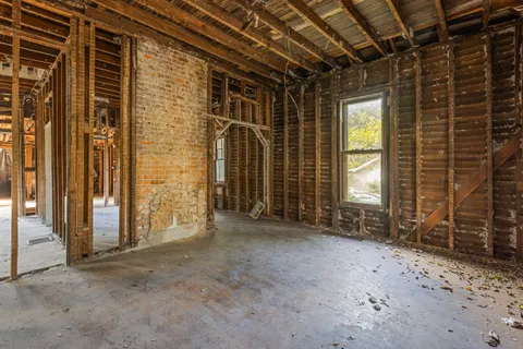 a view of a room with wooden walls