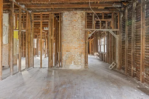 a view of a wooden door with a room