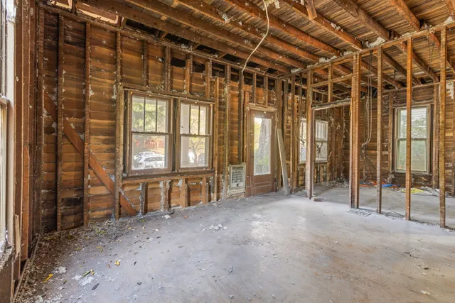 a view of an empty room with a sliding door