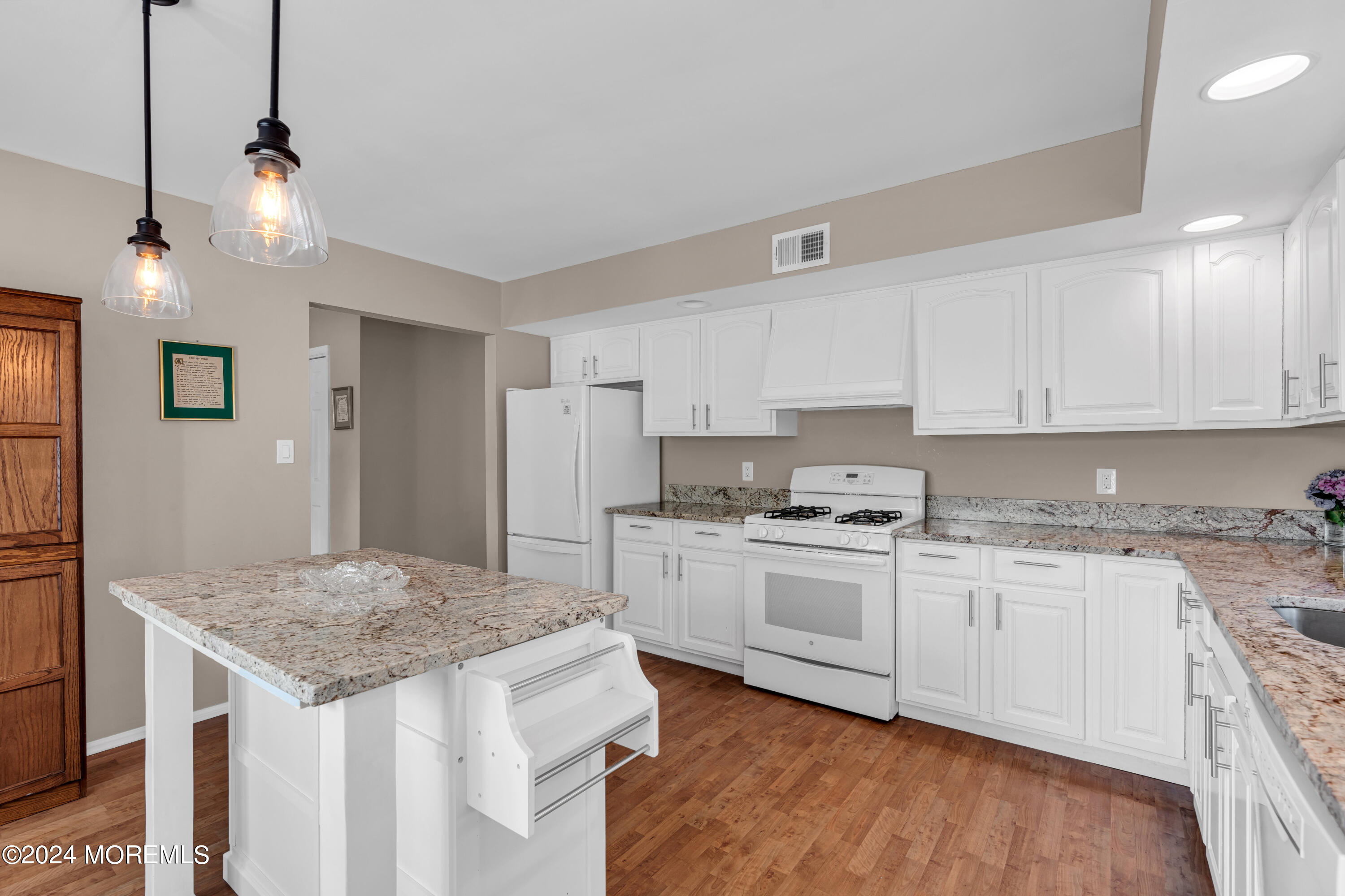 8 Deer Run Lane Brick, NJ 08724 - Photo 11 of 42 a kitchen with granite countertop sink stove and refrigerator