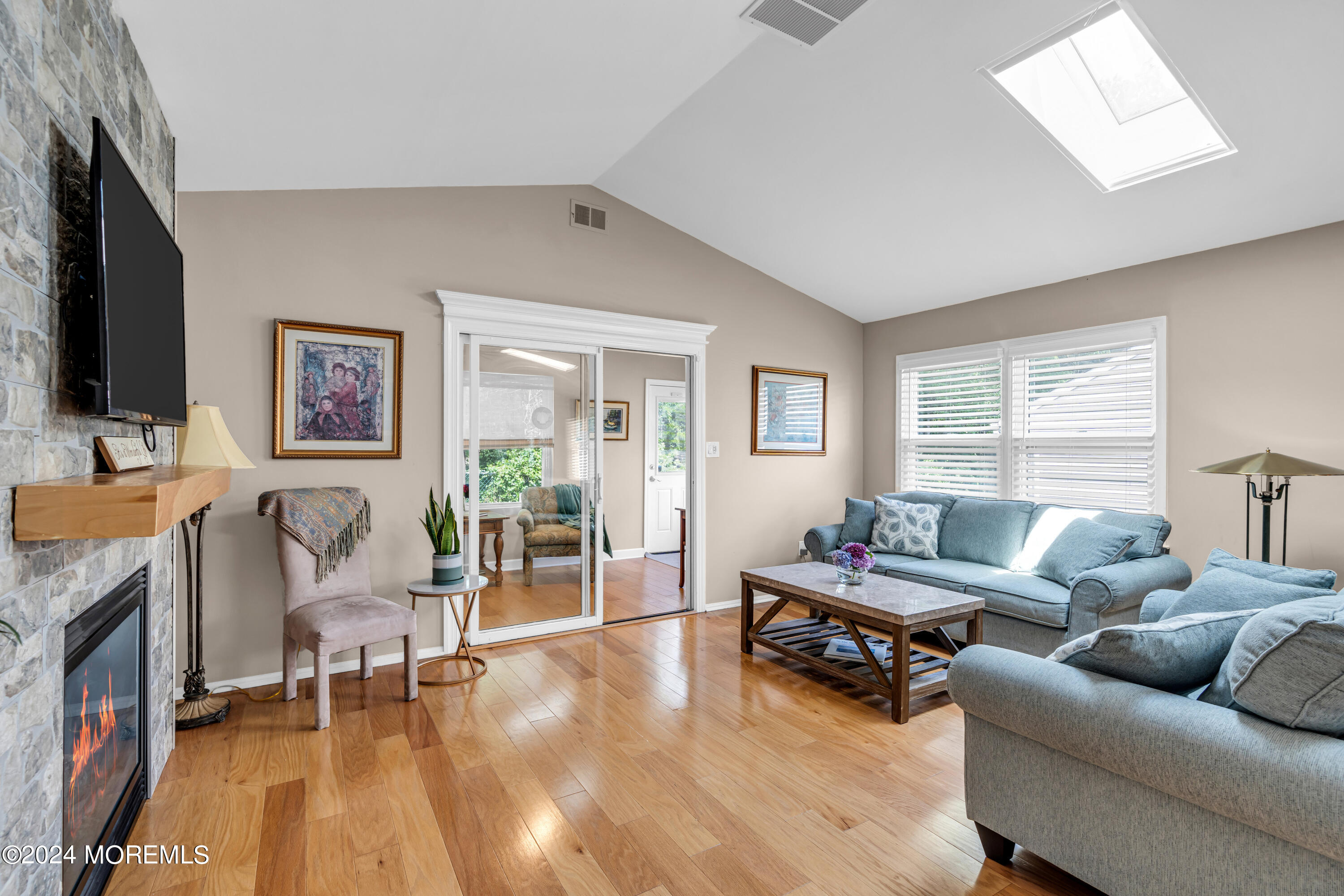 8 Deer Run Lane Brick, NJ 08724 - Photo 15 of 42 a living room with furniture and a flat screen tv with wooden floor