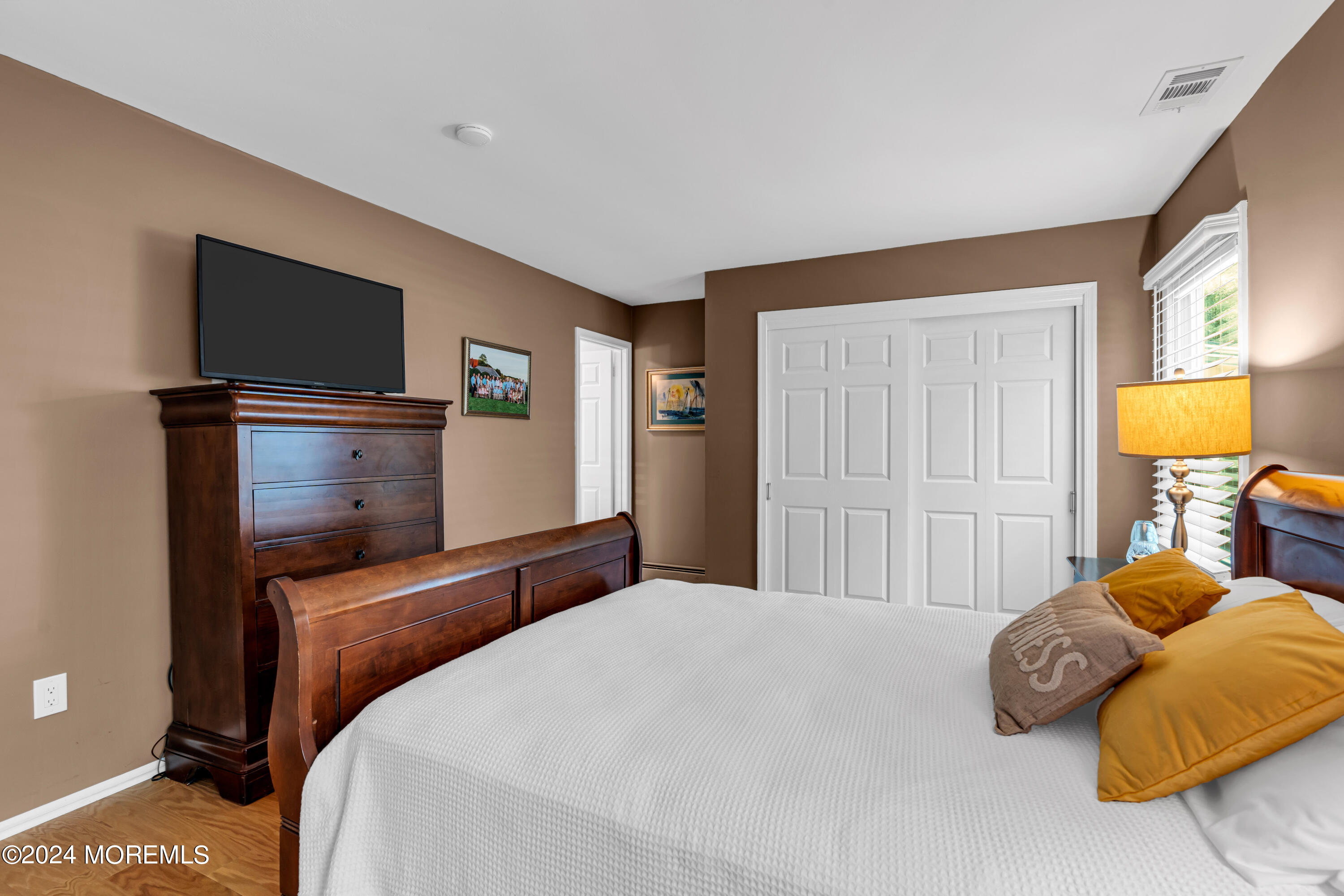 8 Deer Run Lane Brick, NJ 08724 - Photo 26 of 42 a bedroom with a bed and painting on the wall