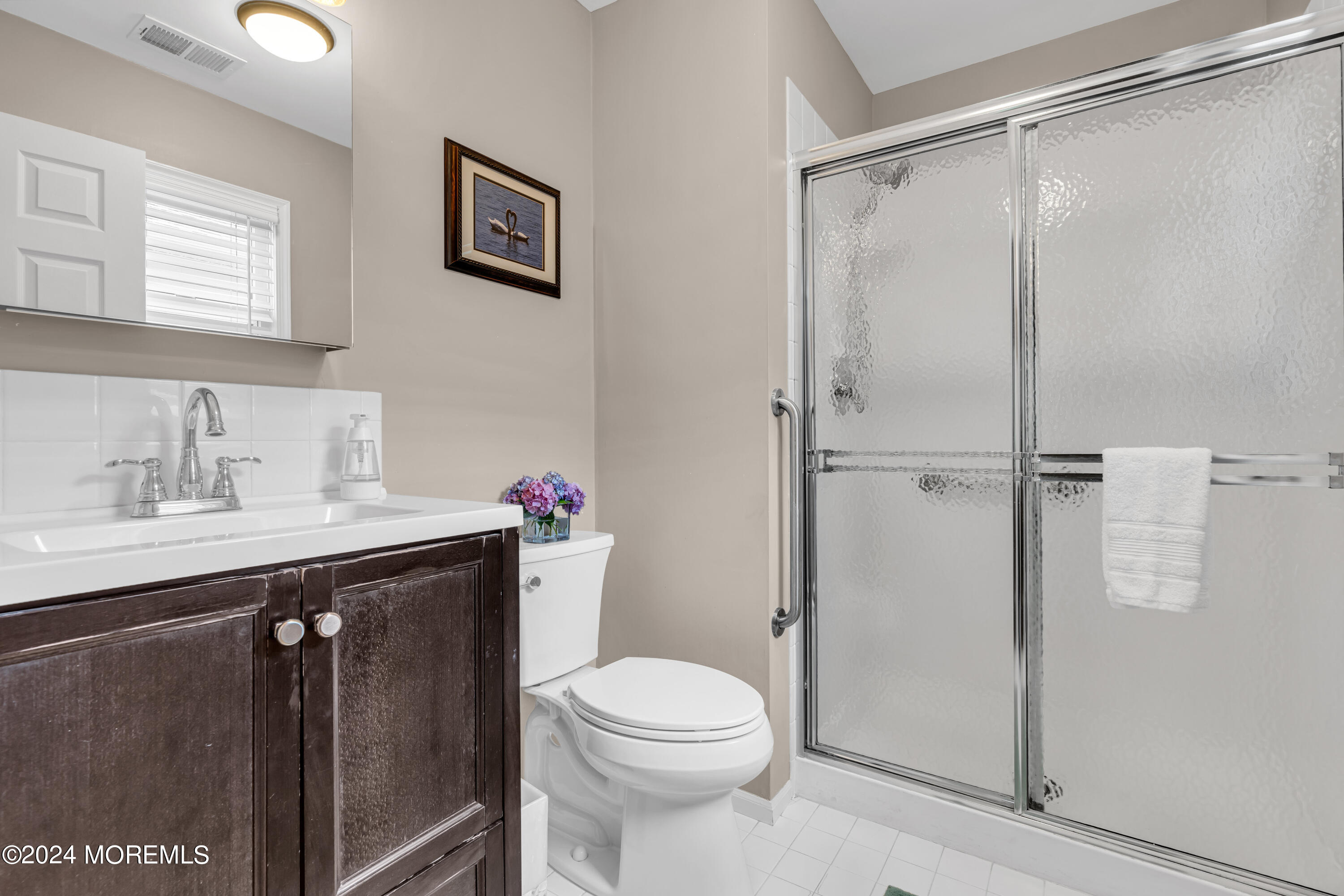 8 Deer Run Lane Brick, NJ 08724 - Photo 27 of 42 a bathroom with a sink a toilet and shower