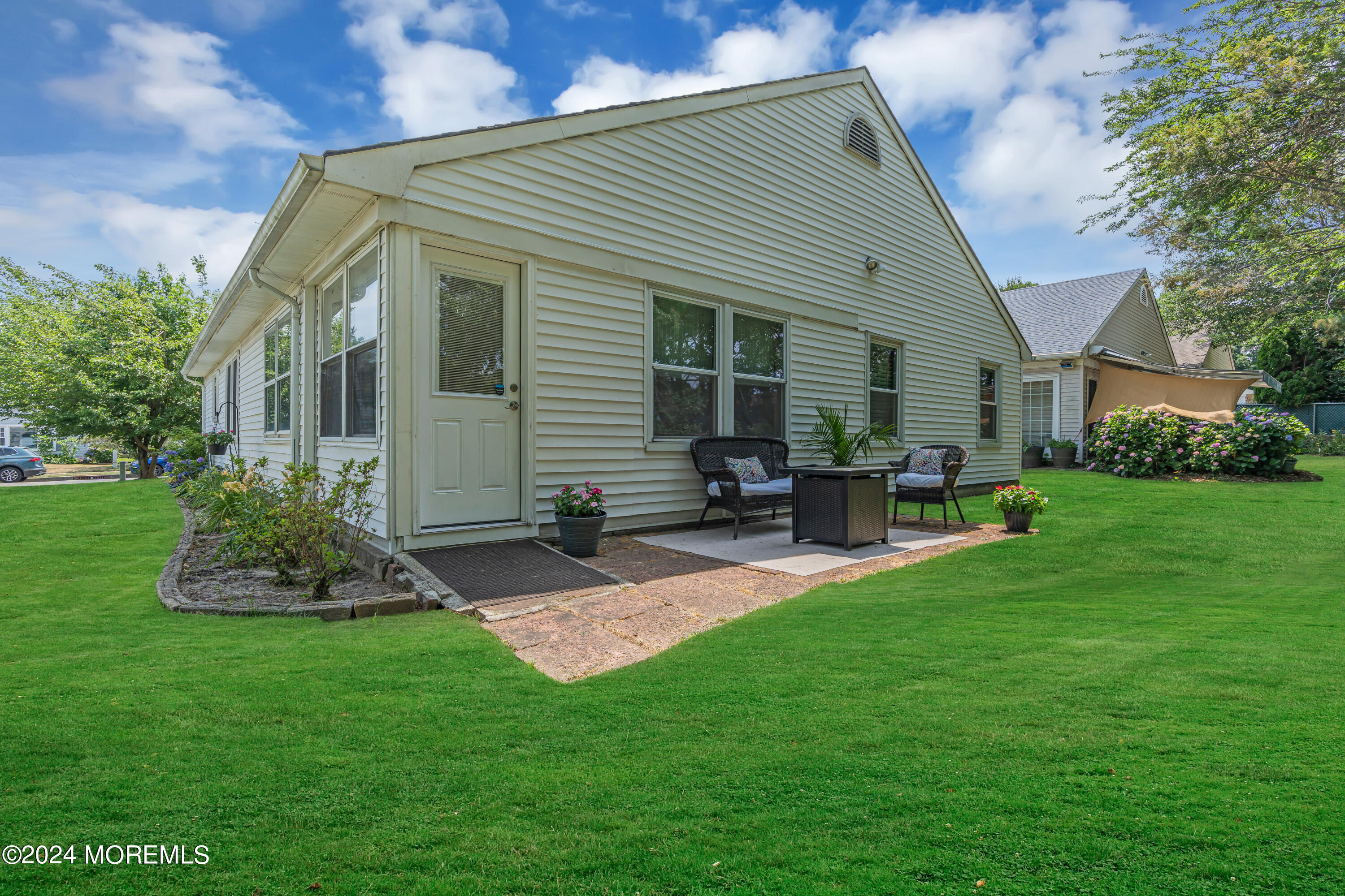 8 Deer Run Lane Brick, NJ 08724 - Photo 32 of 42 a front view of house with yard and outdoor seating