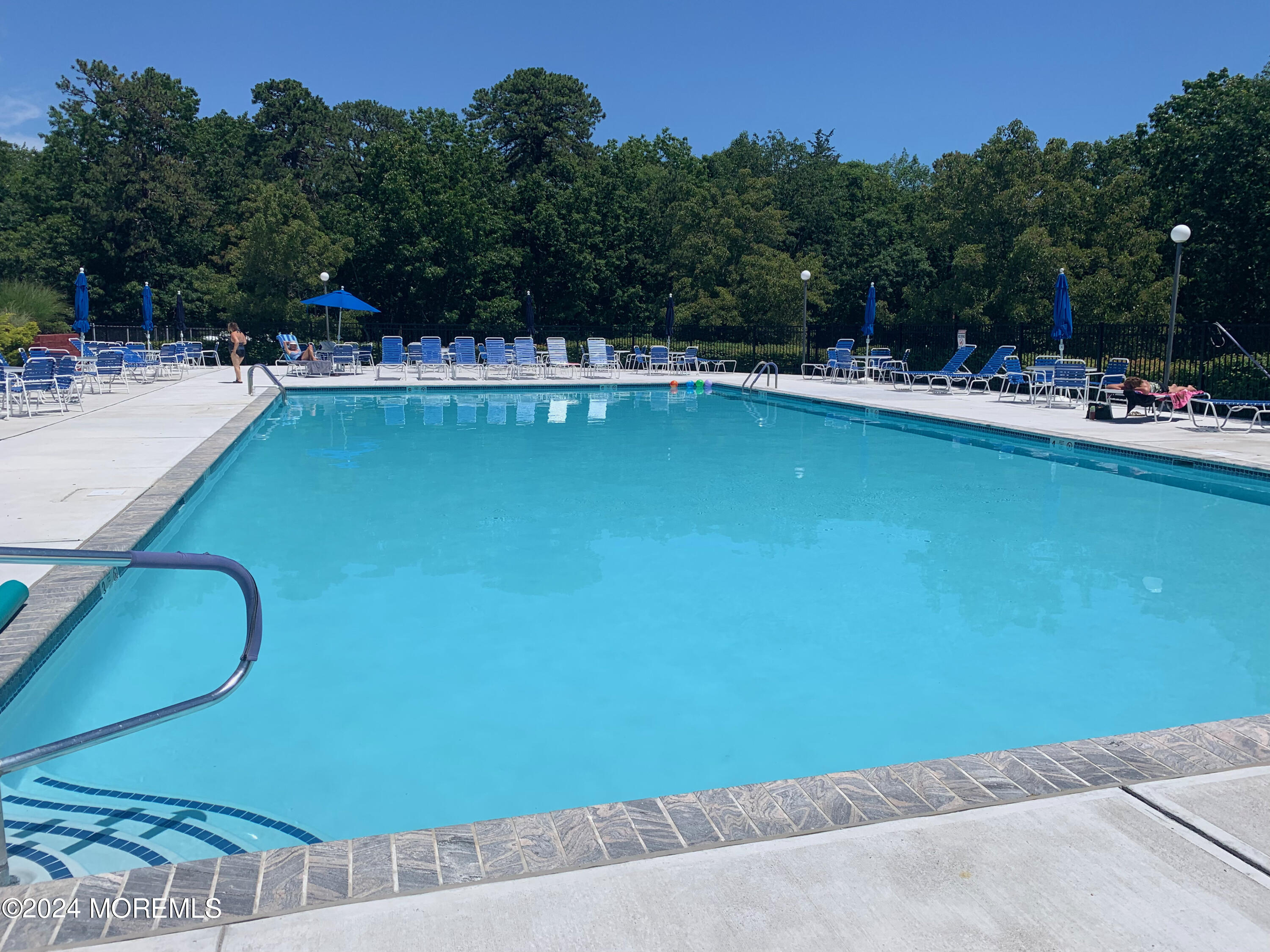 8 Deer Run Lane Brick, NJ 08724 - Photo 40 of 42 a view of a swimming pool with outdoor seating