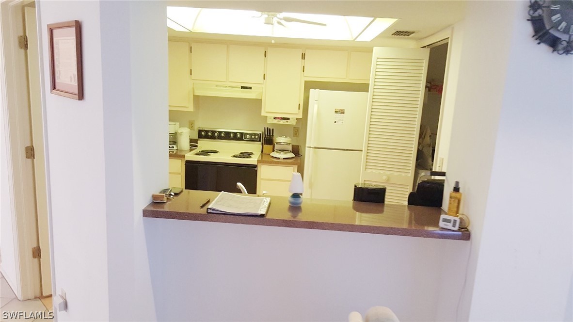 606 Robert Avenue Lehigh Acres, FL 33936 - Photo 11 of 14 a bathroom with a sink and a mirror