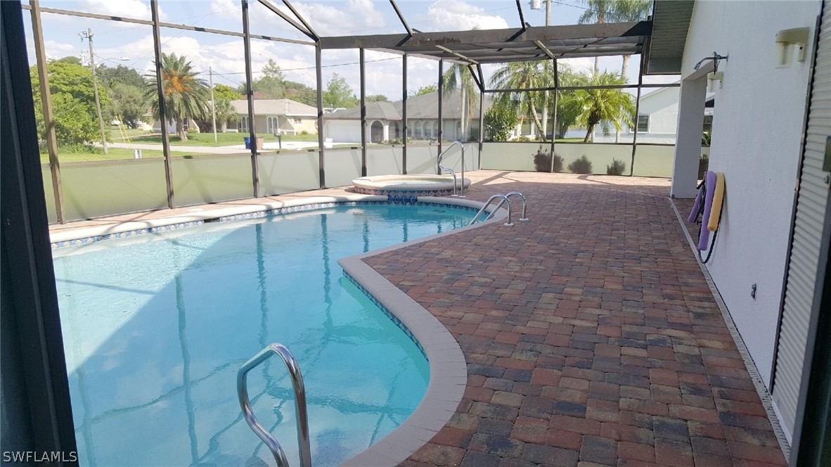 606 Robert Avenue Lehigh Acres, FL 33936 - Photo 8 of 14 a living room with a large window