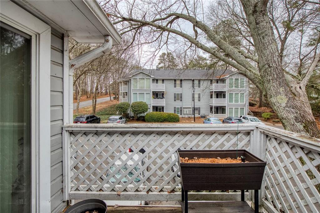 310 Natchez Trace Atlanta, GA 30350 - Photo 12 of 55 a view of a chairs and tables in the balcony