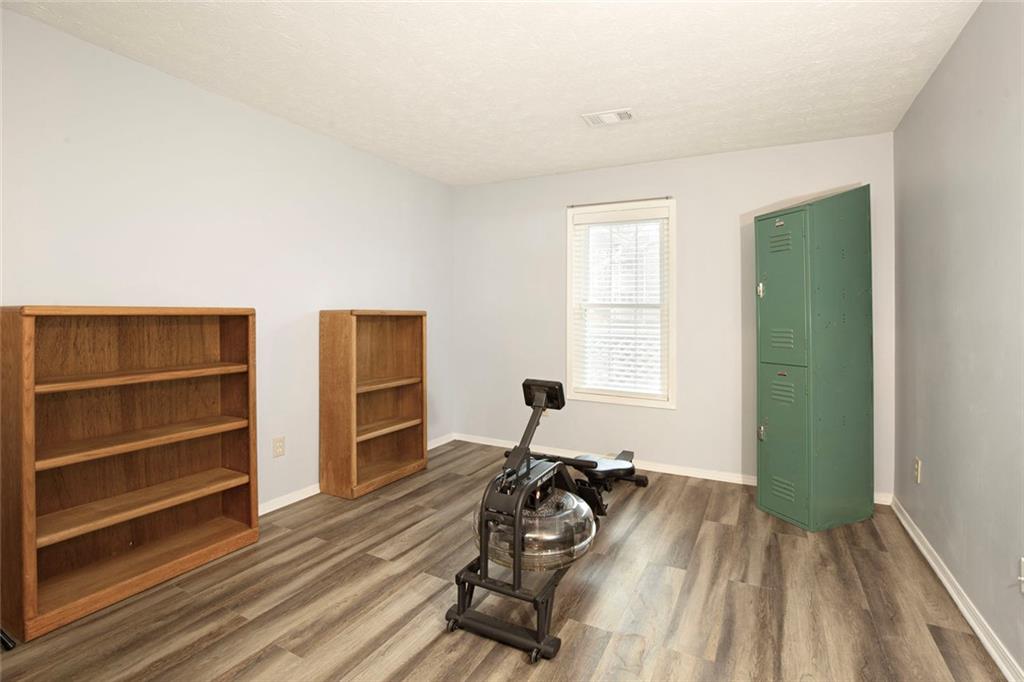 310 Natchez Trace Atlanta, GA 30350 - Photo 25 of 55 a view of a room with furniture and wooden floor
