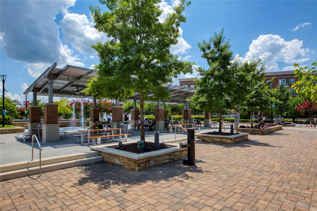310 Natchez Trace Atlanta, GA 30350 - Photo 43 of 55 a view of a patio with a table and chairs