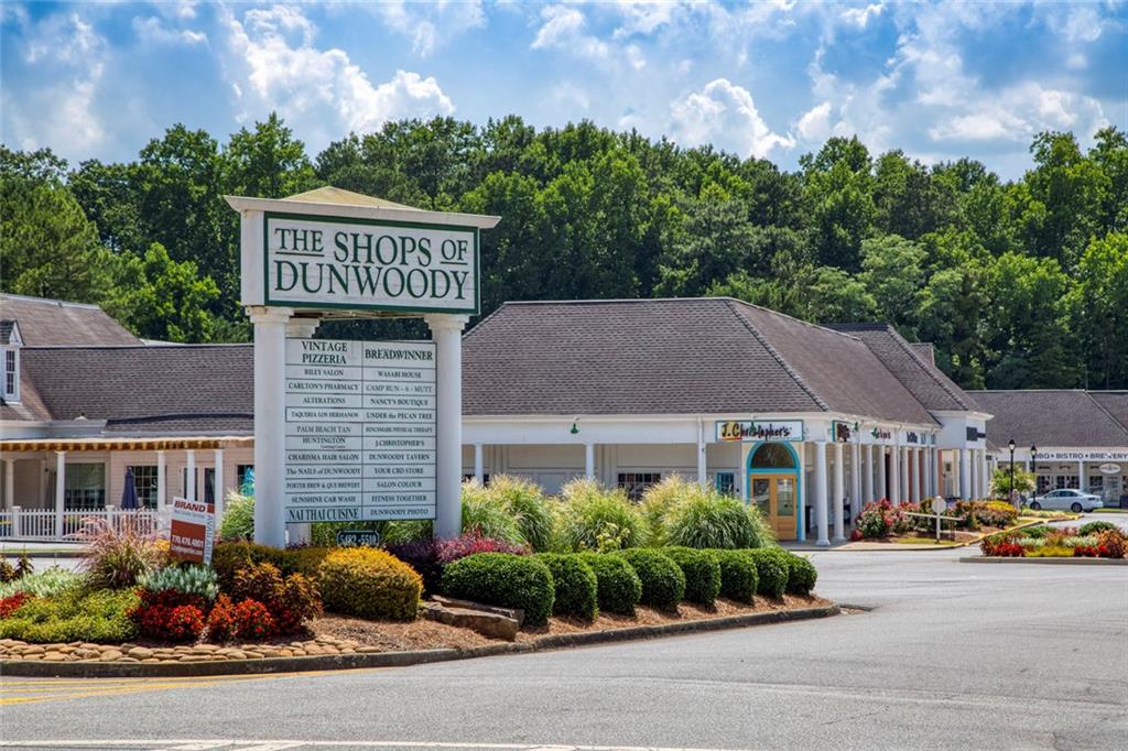 310 Natchez Trace Atlanta, GA 30350 - Photo 50 of 55 a front view of a house with garden