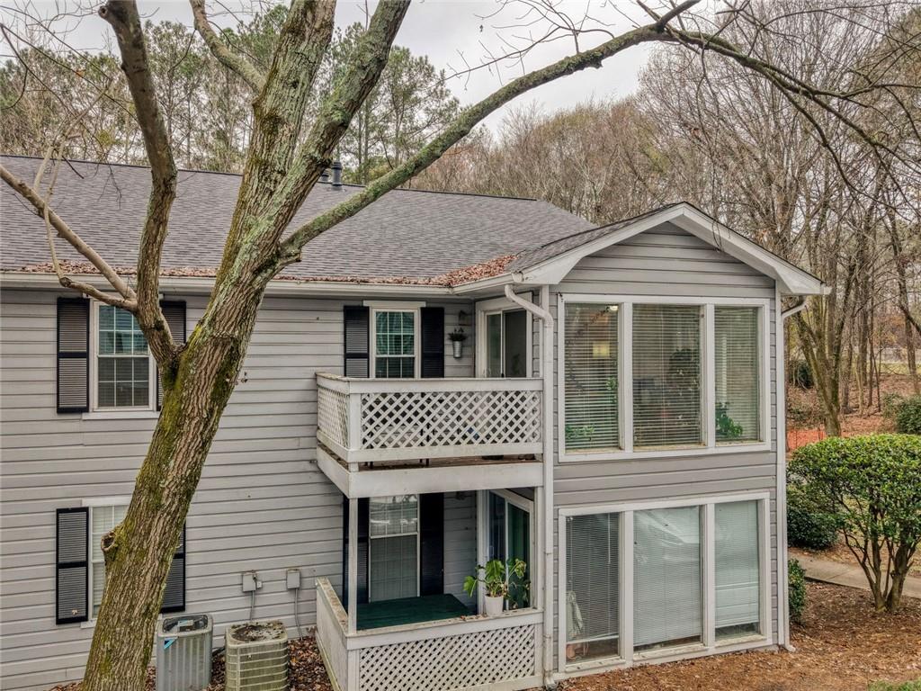 310 Natchez Trace Atlanta, GA 30350 - Photo 51 of 55 a front view of a house with a garden
