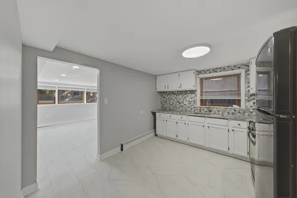 a bathroom with a granite countertop sink mirror and double