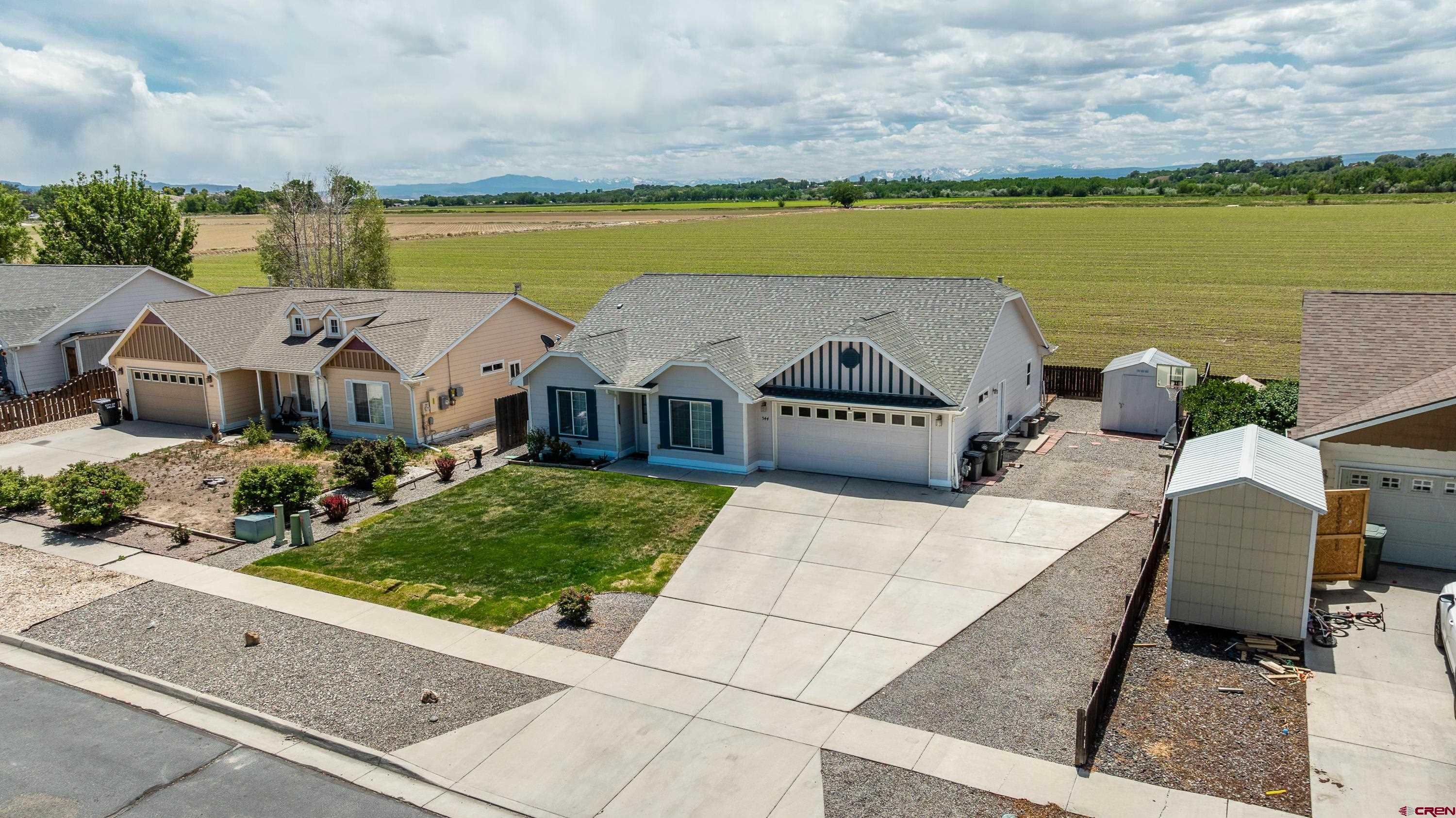 544 20th Street Delta, CO 81416 - Photo 38 of 44 an aerial view of a house with garden space and ocean view